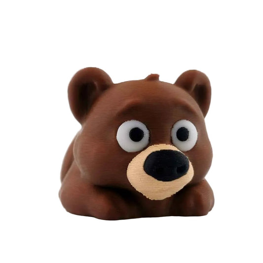 3D printed articulated bear figure standing, full side profile
Articulated bear figure posed with body curved, showing flexible joints
Bear figure in standing pose showing rounded ears and snout
