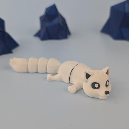 3D printed articulated arctic fox keychain figure with white coat, full side profile