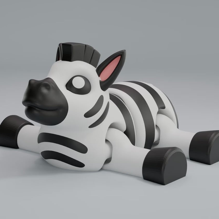 3D printed articulated zebra keychain figure with black-and-white stripes, side profile
Articulated zebra figure front view, showing flexible joints
Zebra articulated figure posed on a stone, full body