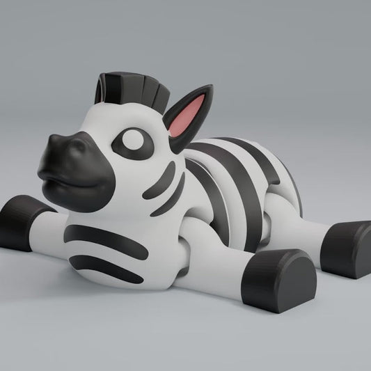 3D printed articulated zebra keychain figure with black-and-white stripes, side profile
Articulated zebra figure front view, showing flexible joints
Zebra articulated figure posed on a stone, full body