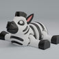 3D printed articulated zebra keychain figure with black-and-white stripes, side profile
Articulated zebra figure front view, showing flexible joints
Zebra articulated figure posed on a stone, full body