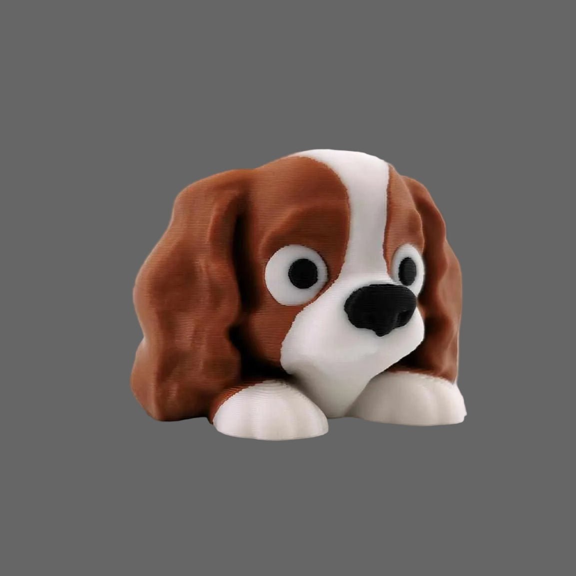 3D printed articulated Cavalier King Charles Spaniel figure, full side profile
Cavalier King Charles Spaniel articulated figure posed, showing flexible joints
Cavalier King Charles Spaniel figure front view showing face and long ears
Close-up of articulated Cavalier King Charles Spaniel showing coat detail and joints


