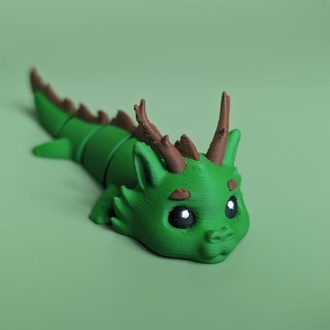 Green articulated 3D-printed Forest Dragon flexi, front view, posed standing — 864 ToyLabs

