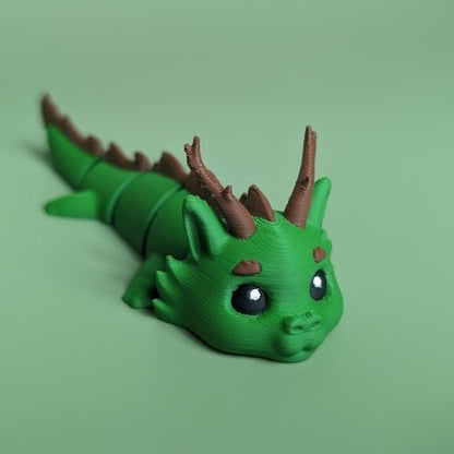 Green articulated 3D-printed Forest Dragon flexi, front view, posed standing — 864 ToyLabs
