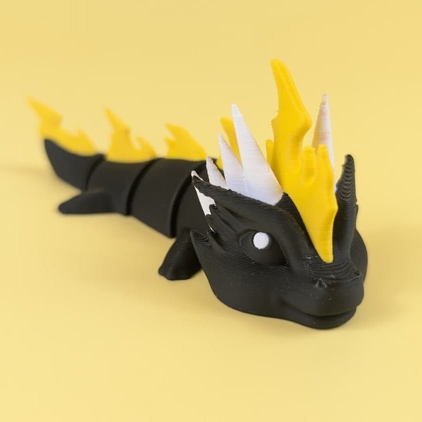 Thunder Dragon flexi, left side profile showing jointed body and tail — 864 ToyLabs