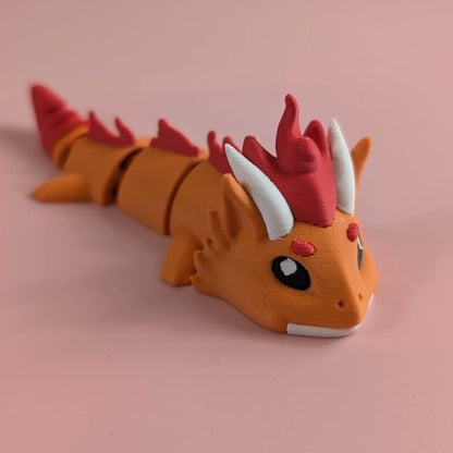3D-printed Fire Dragon articulated flexi keychain, front view posed standing — 864 ToyLabs
