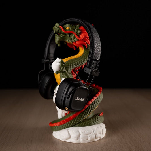 Marshall headphones on a dragon-shaped stand with a black background