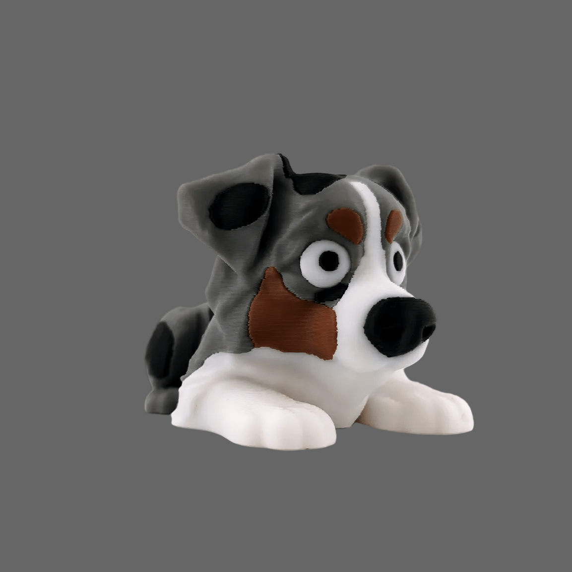 Australian Shepherd articulated figure, close-up of coat pattern and face
Gray Australian Shepherd articulated figure, side profile
Australian Shepherd figure in curved pose showing range of motion

