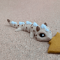 3D-printed Cookie Dragon articulated flexi keychain in cookie-brown, front view posed standing — 864 ToyLabs