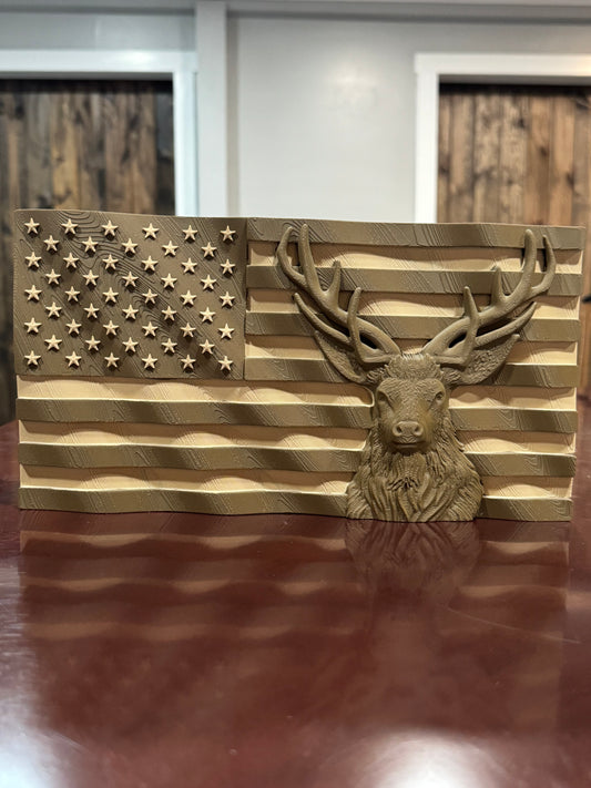 Wood-filament American flag with deer mounted on a wall, angled view