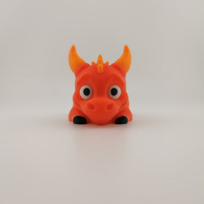 Articulated 3D printed flexi dragon shown in side profile
Flexi dragon posed to show its bending, segmented body and tail
