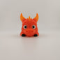 Articulated 3D printed flexi dragon shown in side profile
Flexi dragon posed to show its bending, segmented body and tail
