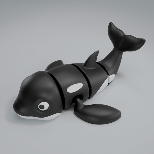 3D printed articulated orca whale figure, full side profile
Articulated orca figure posed mid-swim, flexible body extended
Orca figure showing black-and-white markings and dorsal fin
Close-up of articulated orca figure showing joints

