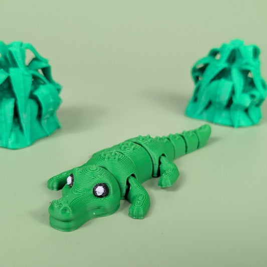 Articulated 3D printed Crocodile figure shown in side profile with textured scales
Crocodile figure posed to show its bending, segmented body
