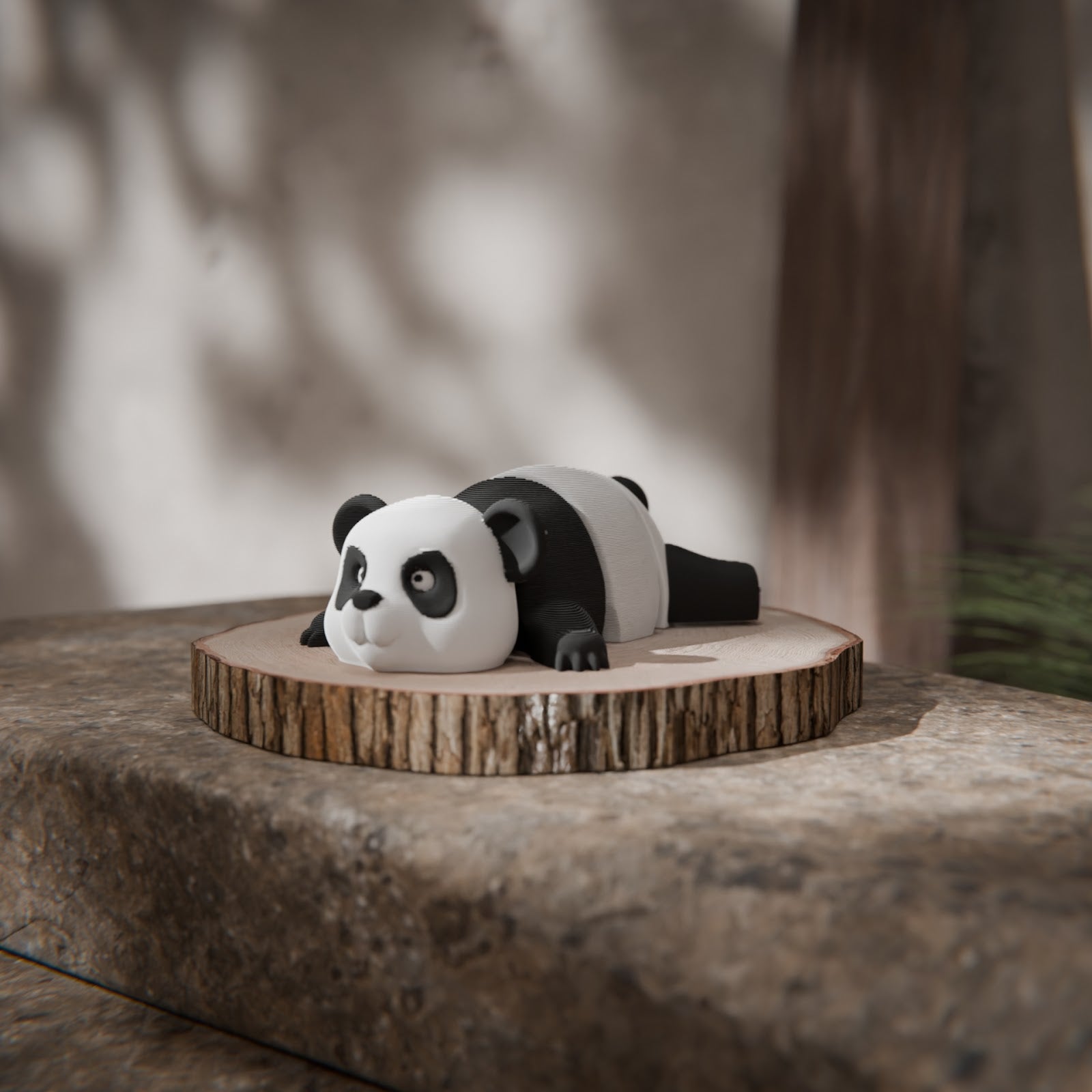 Black and white 3D printed articulated panda keychain figure, front view