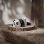 Black and white 3D printed articulated panda keychain figure, front view