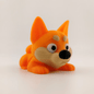 Articulated 3D printed flexi dog figure shown in side profile
Posed flexi dog bending at its flexible joints to show articulation
Front view of the flexi dog's face